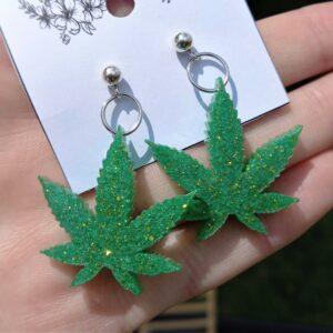 Sterling Silver earrings with green glittering golf cannabis leaves.